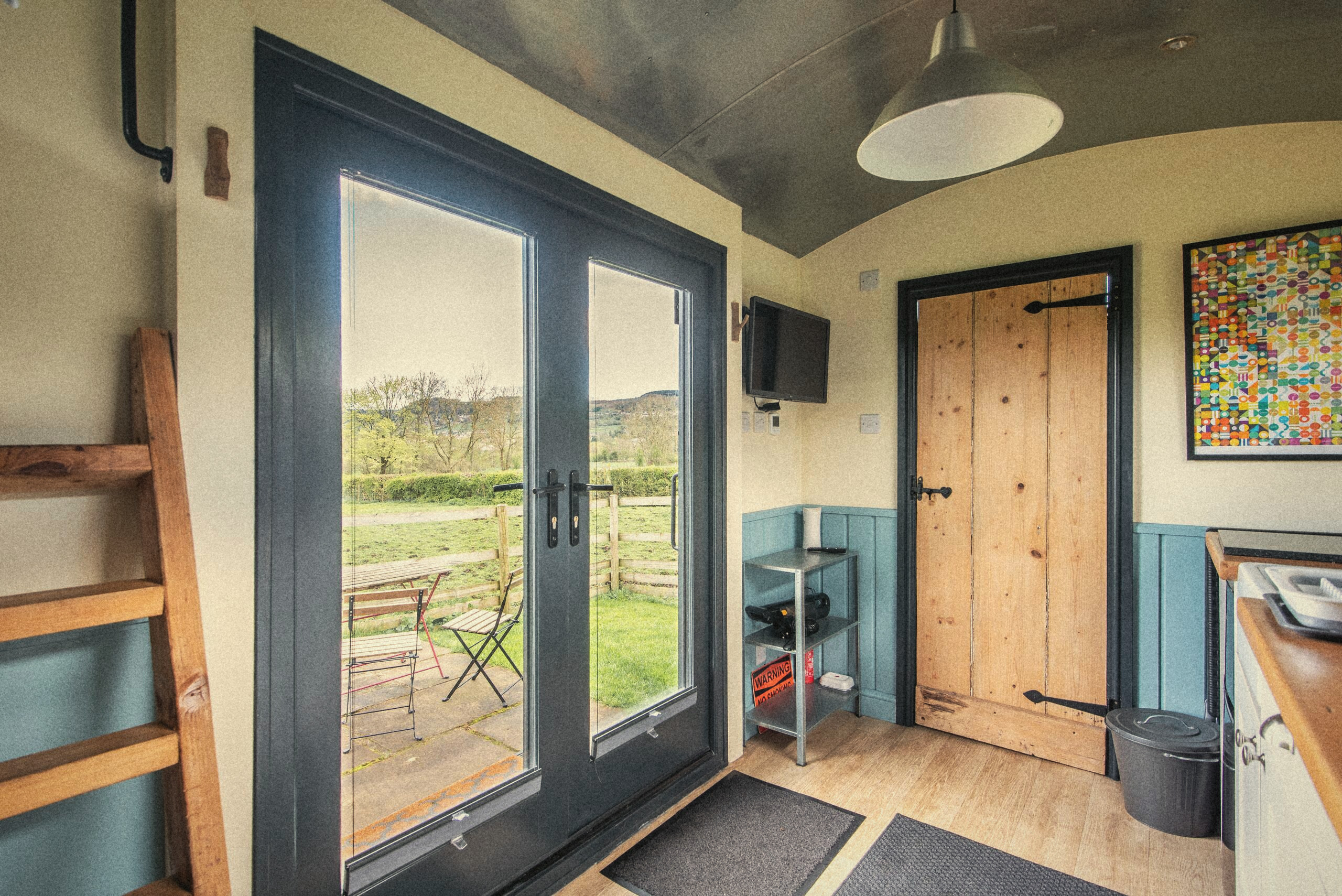Inside The Carriage looking through the patio doors to the field