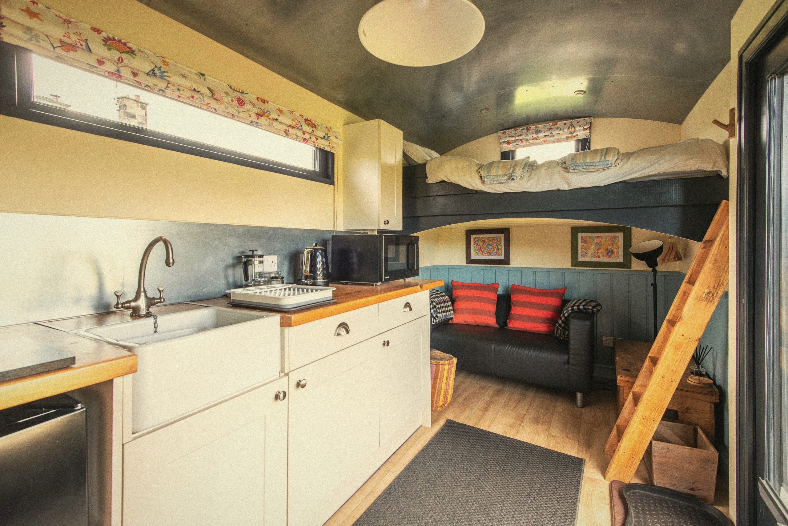 The Carriage kitchen with the sitting area beyond