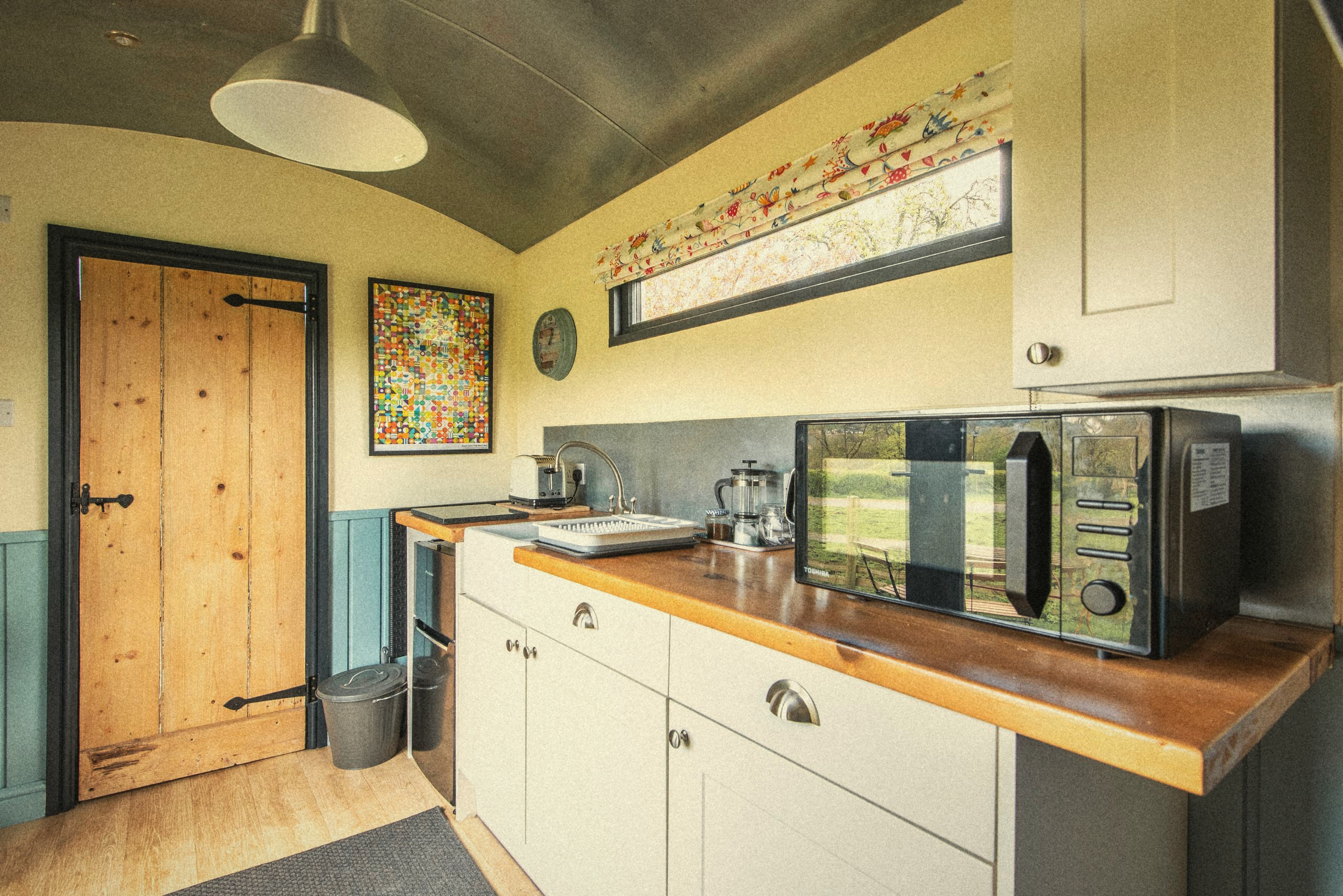 The kitchen worktop with microwave and kettle