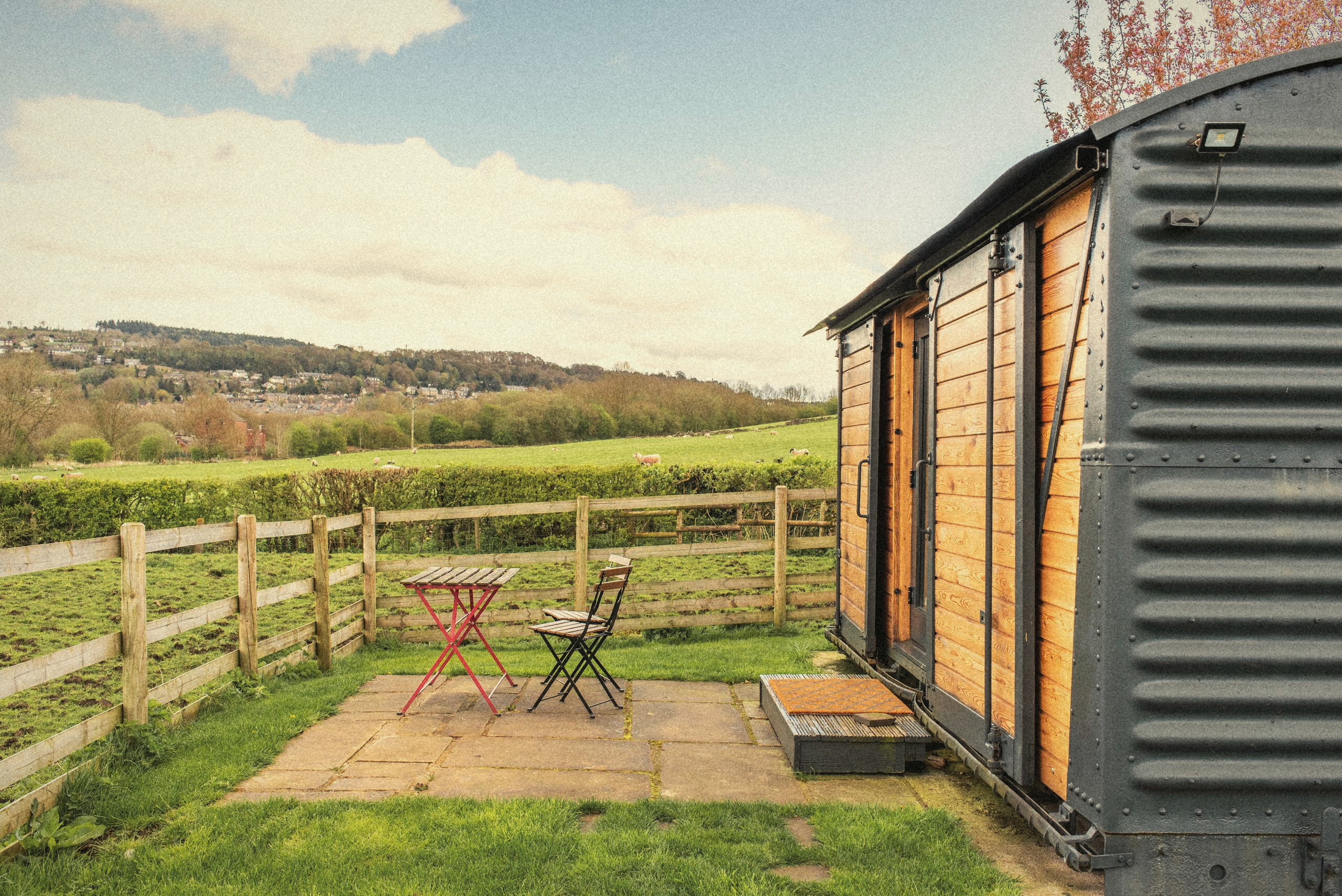 The Carriage and its private patio overlooking the field