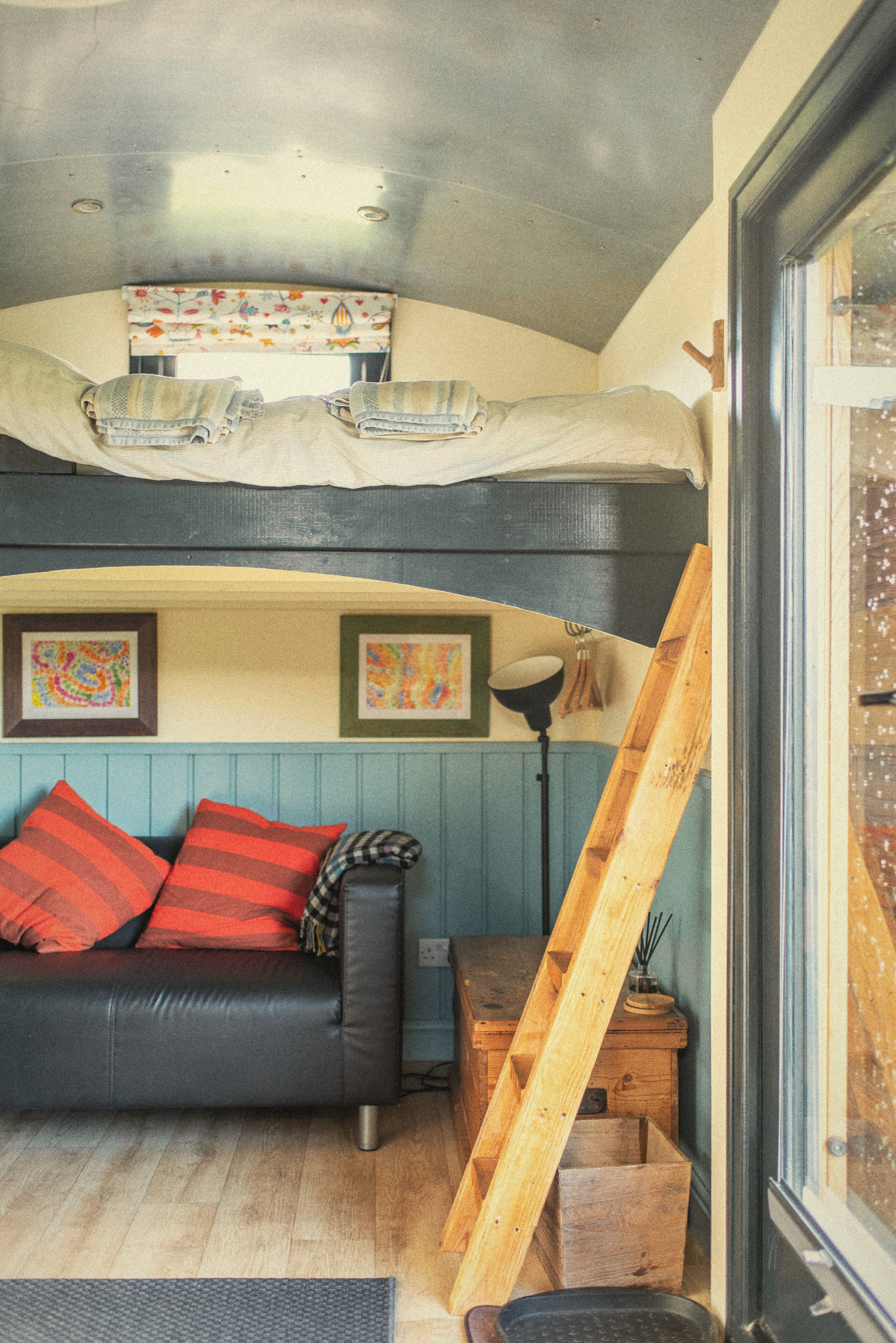 The Carriage sitting area with raised bed and ladder
