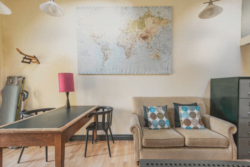 The sitting area with settee and world map