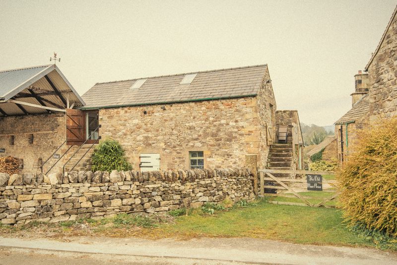 The stone barns beside the yard