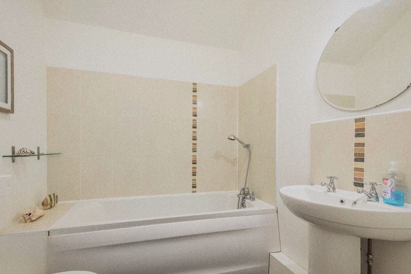 The bathroom with bath and basin
