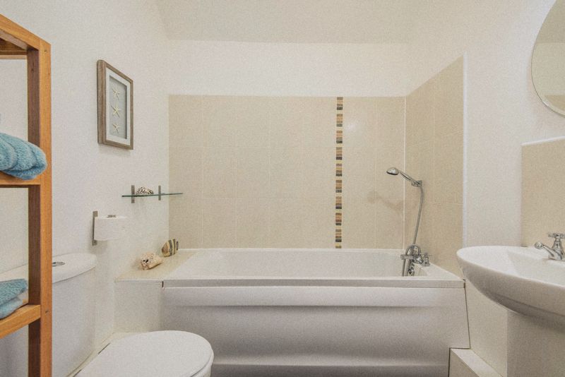 The bathroom with bath and shower