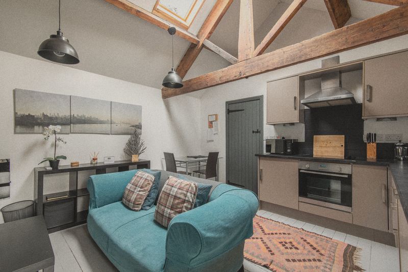 Kitchen and lounge under the oak beams