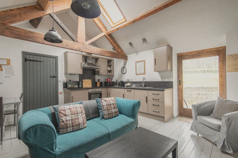 The lounge and kitchen under the beams
