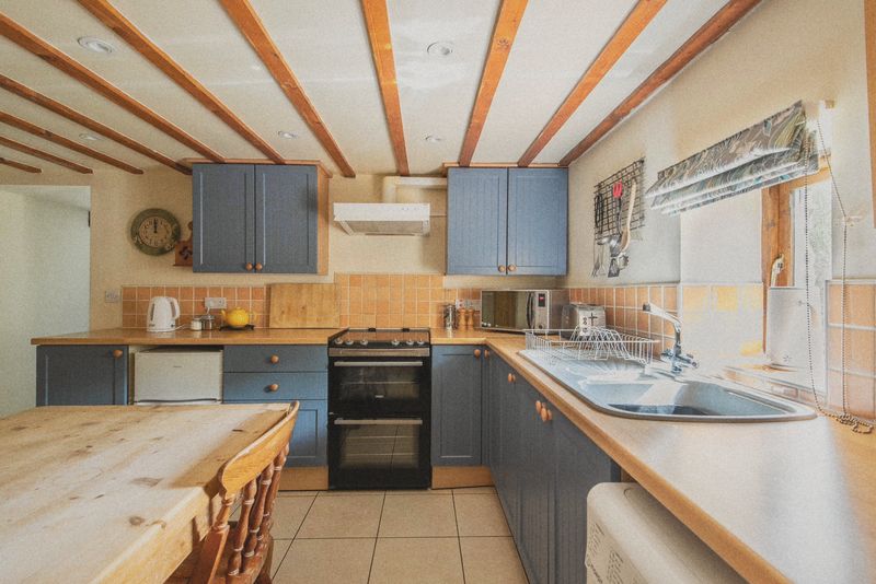 The kitchen units, oven and window